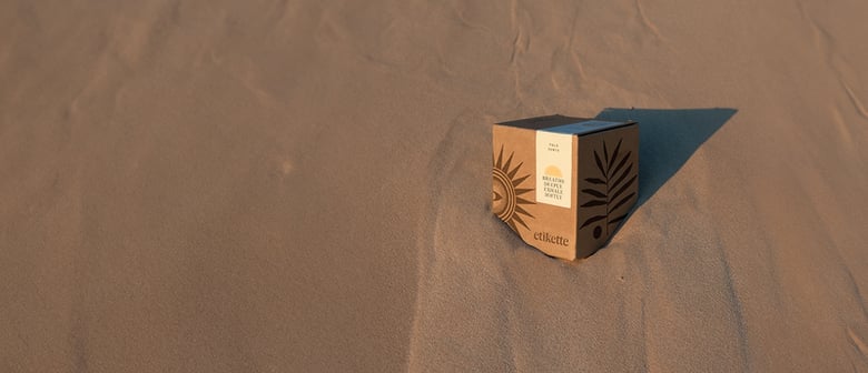 Photo of Etikette Candle in Sand.